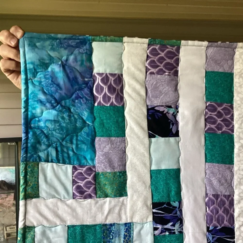NWT. Hand Crafted Quilt of Blues, Purples and Turquoises
